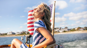 Addie dress in oxford stripe in monomoy on sailboat.